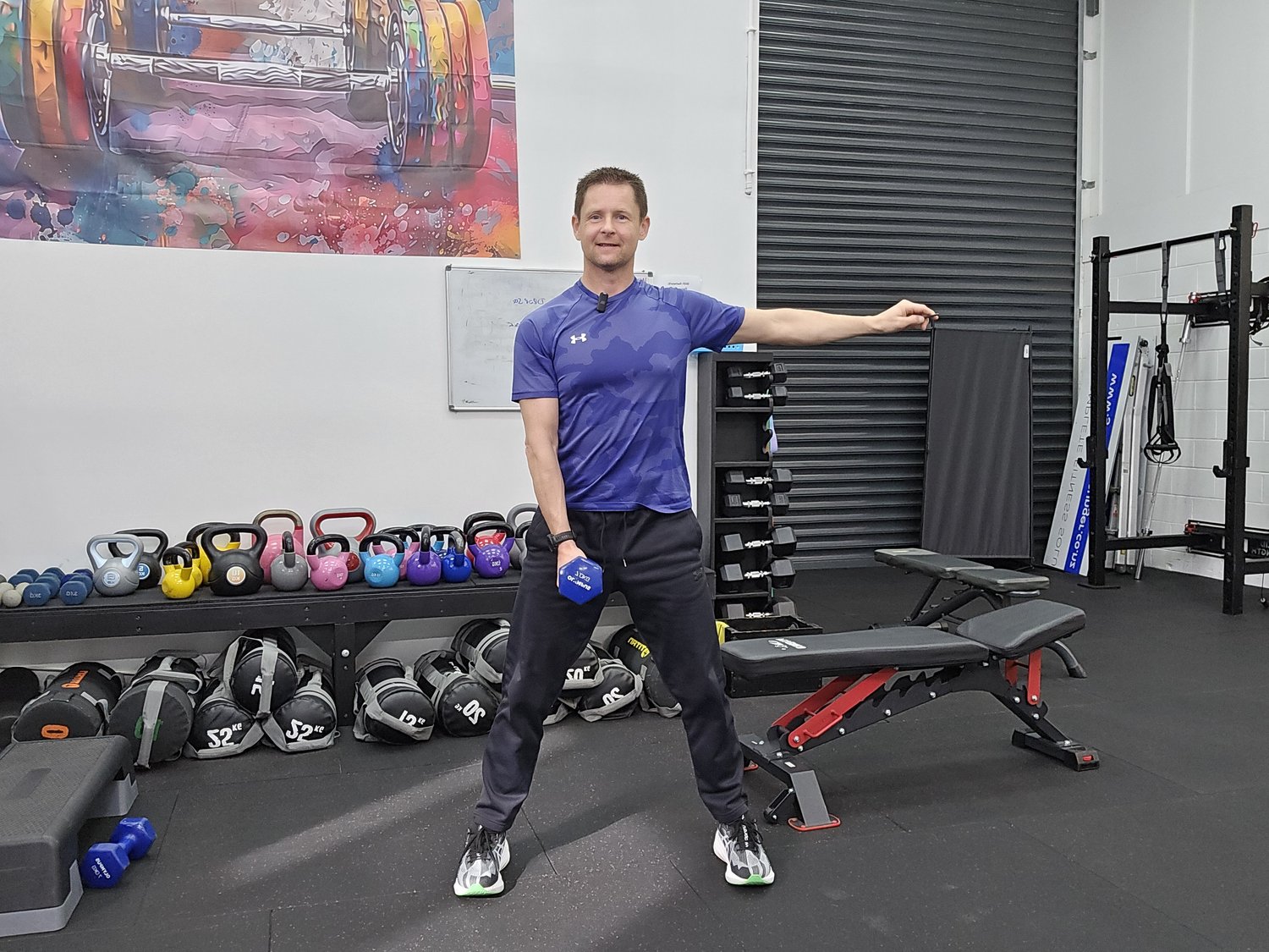 Gavyn training with a dumbbell at Fit Life After 40